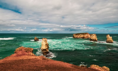 The formation of clouds during the day the sea surface brown rocks
